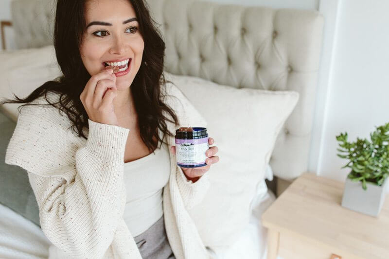 Woman eating Nano CBD Gummies - Mission Farms CBD